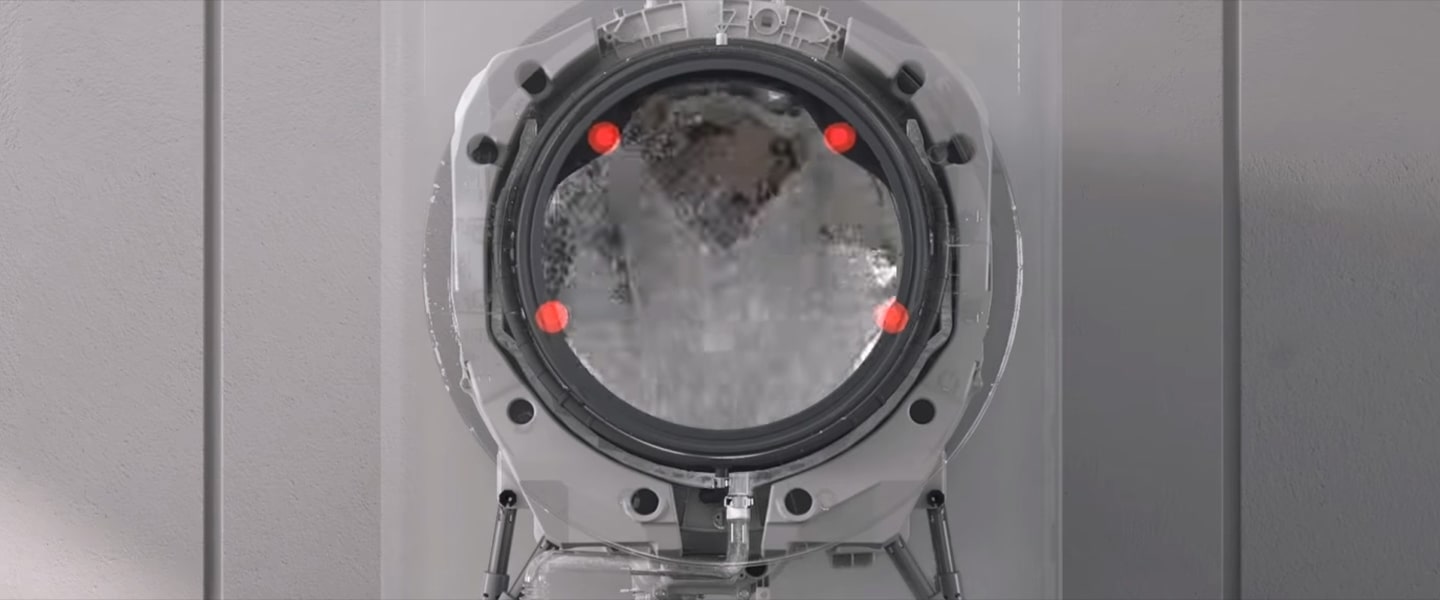 Immagine del cestello con i 4 getti d'acqua del TurboWash39 che escono dagli ugelli.