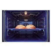 Foto focus interno del forno con cibo LG WSED7664S