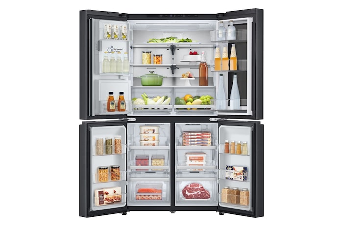 Frigorifero aperto completamente pieno di alimenti