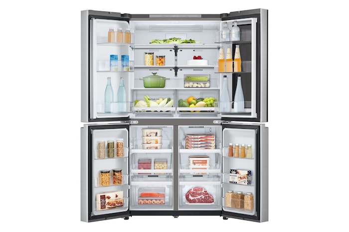 Frigorifero aperto completamente pieno di alimenti