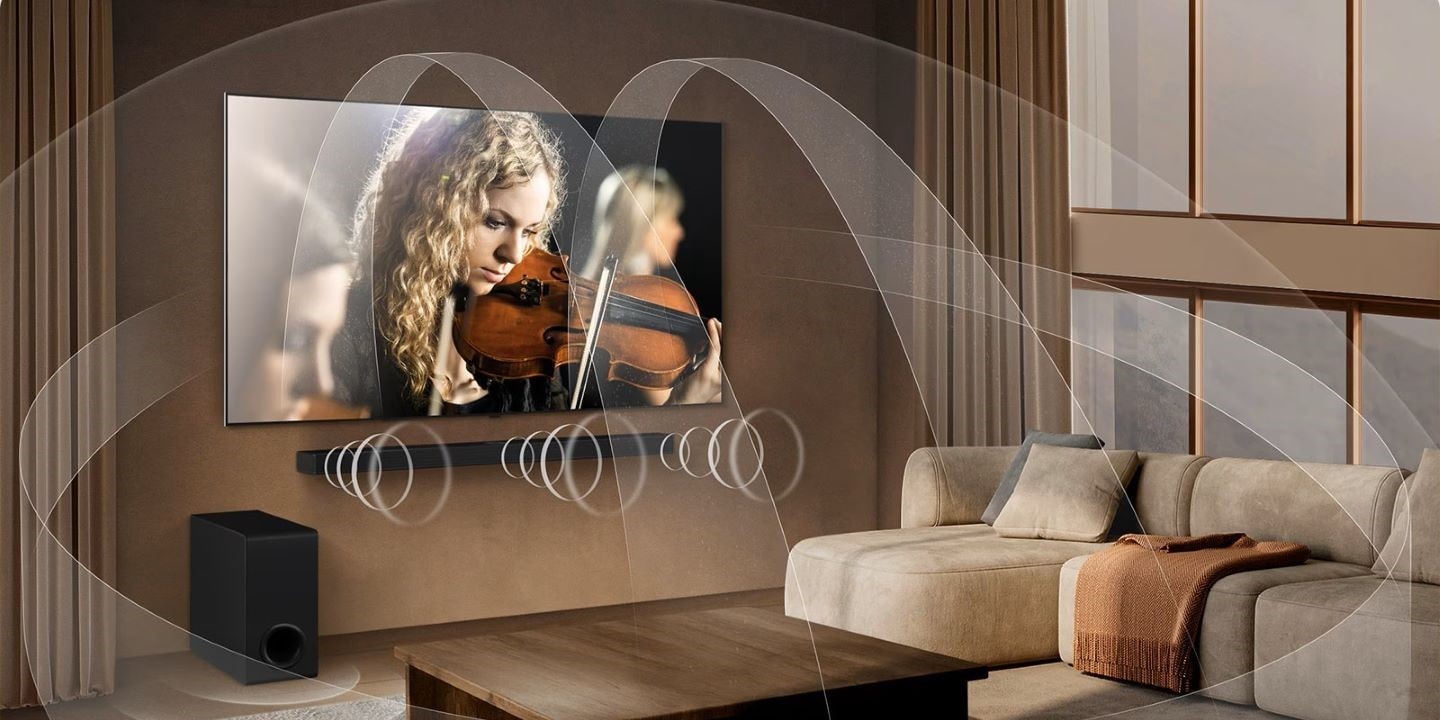 smart tv con miglior audio: immagine di un TV Oled B5 LG, che mostra una violinista che suona e le funzionalità immersive di WOW Orchestra.