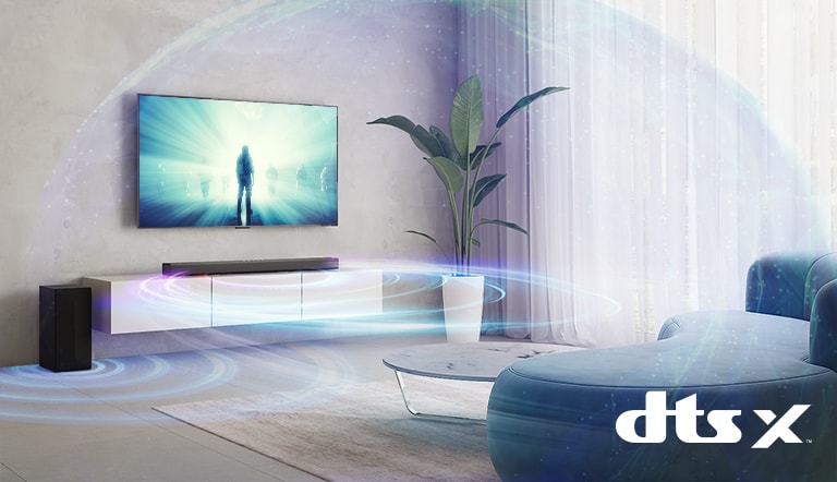 In the living room, LG TV is on the wall. A moive is playing on TV screen. LG Sound bar is right below TV on a grey shelf with a sub-woofer right next. A set of 2 rear speakers are on the back of the living room. Sound effect graphics are coming out from every speakers. Dolby Atmos and DTS:X, IMAX Enhanced logo shown on middle bottom of image.