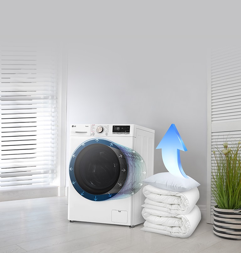 Cuscini e lenzuola accatastati di fianco alla lavasciuga che diventano una freccia.