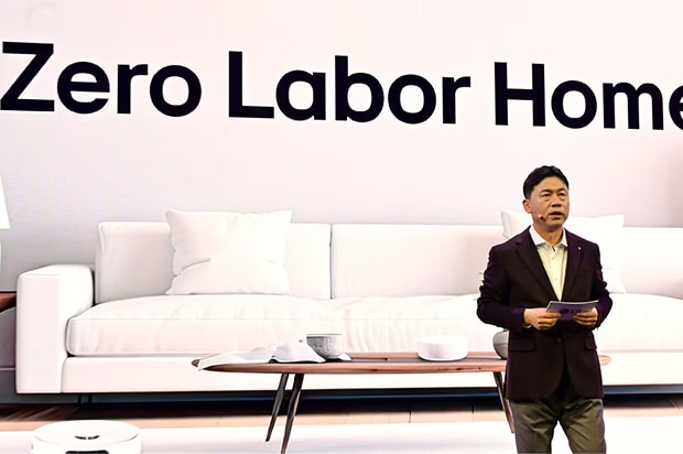 LG Electronics CEO Jae-cheol Lyu giving a presentation in front of a large "Zero Labor Home" sign with a modern living room backdrop.