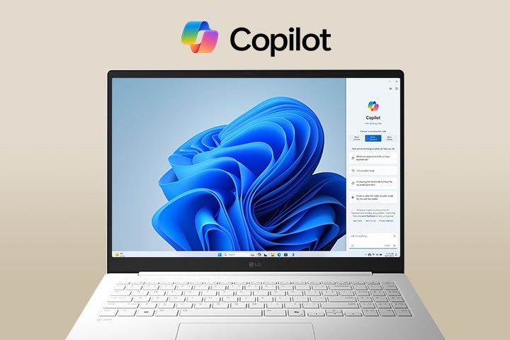 Un computer portatile con il logo di Windows Copilot sopra lo schermo e l’interfaccia di Windows Copilot sul display, che sfoggia un design elegante con un ampio schermo e l’interfaccia di Windows 11 sullo sfondo.