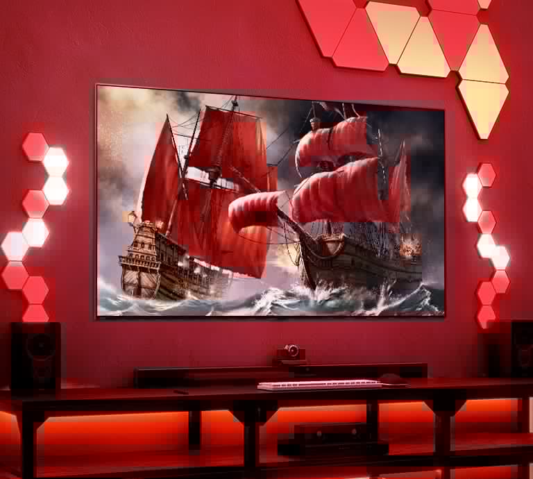 Il TV QNED è posizionato in una sala da gioco rossa con tante piastrelle illuminate. Sullo schermo TV sono mostrate due navi pirata sul mare in burrasca.