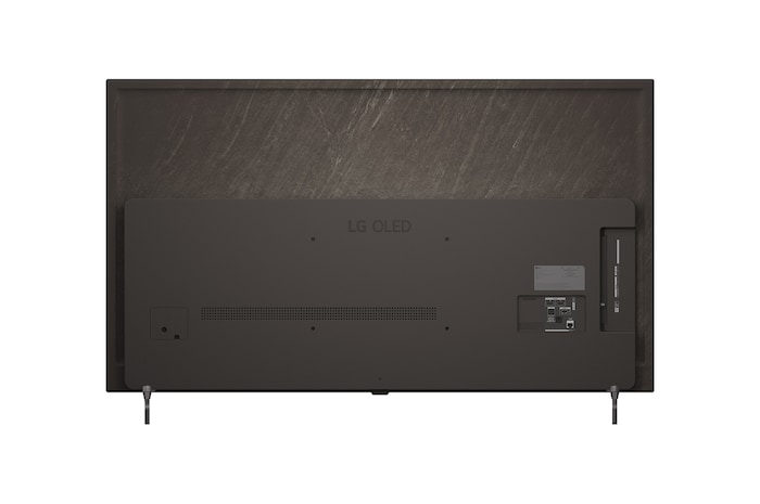 超薄型デザインと極細ベゼルを備えたLG OLED AI B6が、スタイリッシュなリビング空間に壁掛けで設置されている。画面には虹色のトーンで彩られた風景と、層をなす山々の造形が映し出されている。
