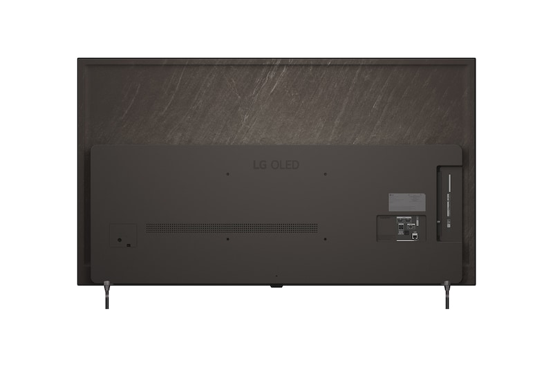 超薄型デザインと極細ベゼルを備えたLG OLED AI B6が、スタイリッシュなリビング空間に壁掛けで設置されている。画面には虹色のトーンで彩られた風景と、層をなす山々の造形が映し出されている。