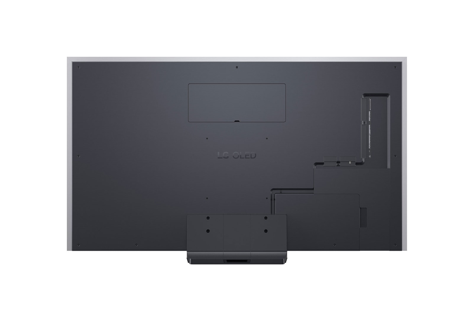 LG OLED evo AI G6 displays a vivid ocean sunset scene, with a soundbar and speaker positioned below the screen, enhancing a calm and atmospheric living space.