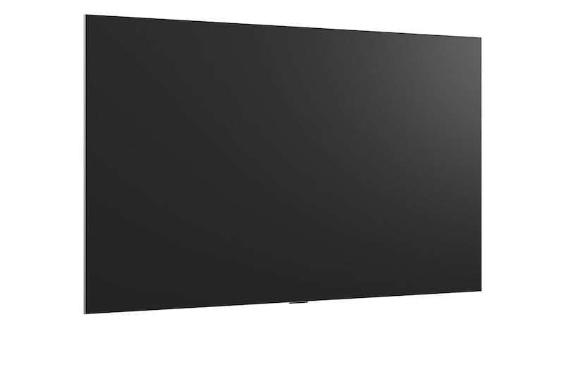 LG OLED evo AI G6 is flush-fit wall-mounted in a modern lifestyle living room, displaying a vivid aurora over a serene coastal village, resembling a framed picture on the wall.