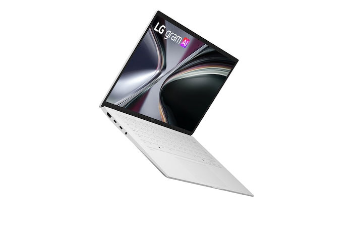 A top-down view of an LG gram laptop surrounded by circular sound wave graphics. The image visually represents immersive spatial audio, with Dolby Atmos branding shown on the lower corner of the scene.