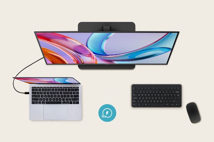 ノートパソコンに接続されたモニターを上から見た図。モニターの下にはキーボードとマウスが配置されている。