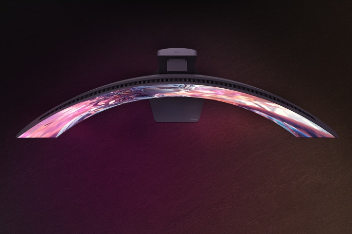 An animated video transitioning from a front view to a top view of a curved monitor.