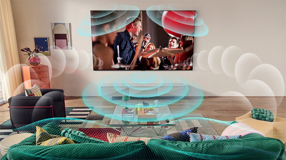 部屋にある LG 有機 EL テレビがコンサートを映し出している画像。バーチャルサラウンドを表現する泡が、空間いっぱいに広がる。