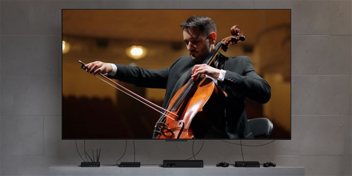 Снимок с очень аккуратным жилым пространством с телевизором LG OLED M5 TV подчеркивает стиль жизни. Не видно никаких проводов. Приставка для нулевого подключения спрятана и едва видна.