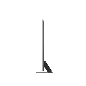 Девушка и собака сидят перед телевизором LG QNED TV, установленным на стене, на экране которого изображены три слона, идущих наружу, над панелью LG Soundbar. Заголовок рассказывает о том, как каждое действие становится более захватывающим на огромном экране.