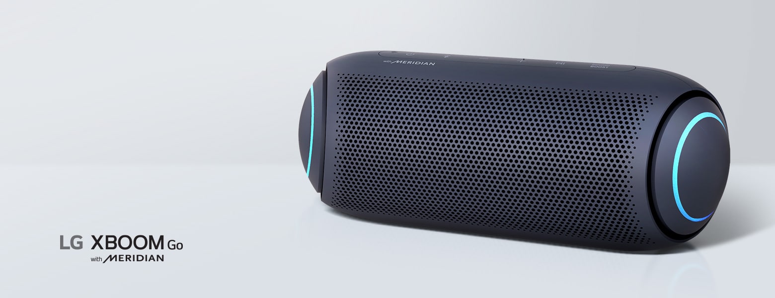 LG XBOOM Go PL7 bluetooth speaker  with sky blue lighting is placed on a grey surface.