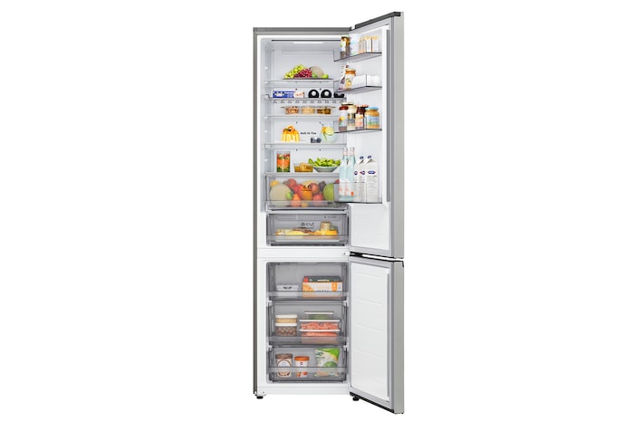 LG bottom freezer (GC-B509EMTM) installed flush in tall warm beige wall with white arrows pointing to top side and front surfaces