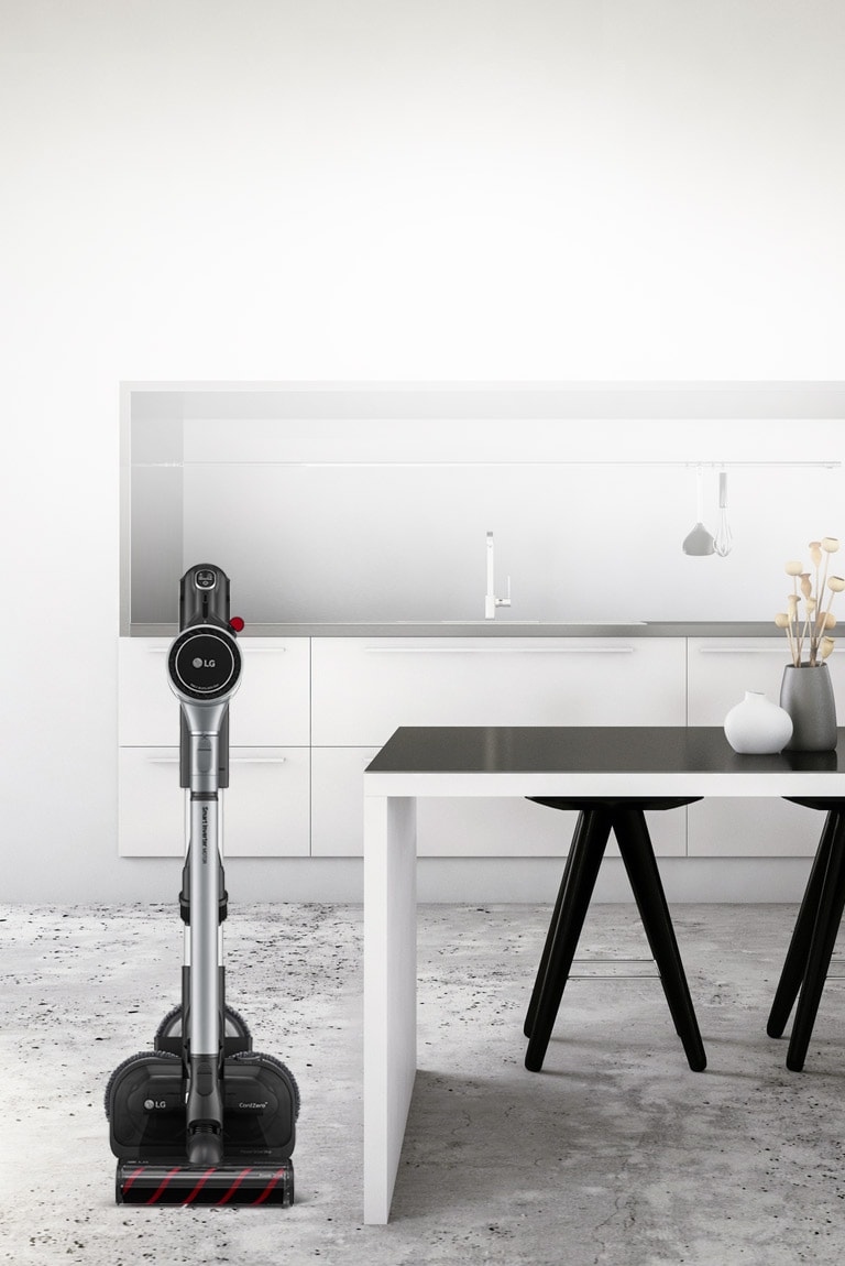 L'aspirateur PROPLUS sur son support est placé près d'un plan de cuisine.