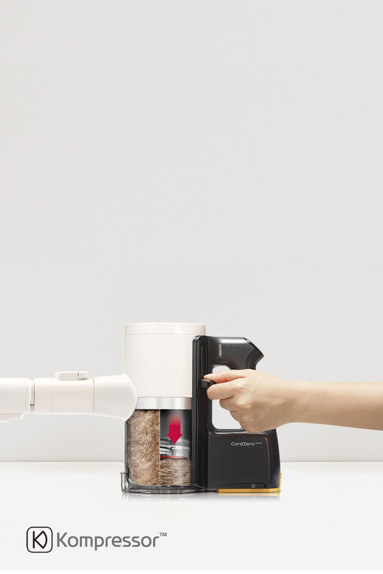Présente la compression de la poussière dans le bac de l’aspirateur.