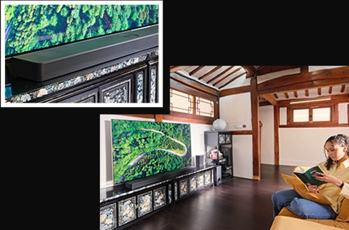 Un huésped está sentado frente a un LG OLED TV leyendo un libro.