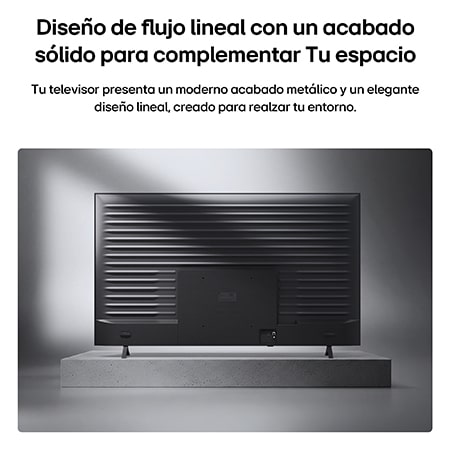 LG QNED evo AI QNED85 Mini LED with a Slim Design is wall-mounted in a bright, open living space, featuring a sleek profile that blends seamlessly into the interior while displaying a bold, colorful abstract artwork.