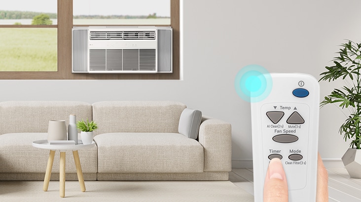 Aire acondicionado de ventana LG enfriando una sala de estar moderna, operado con un control remoto.