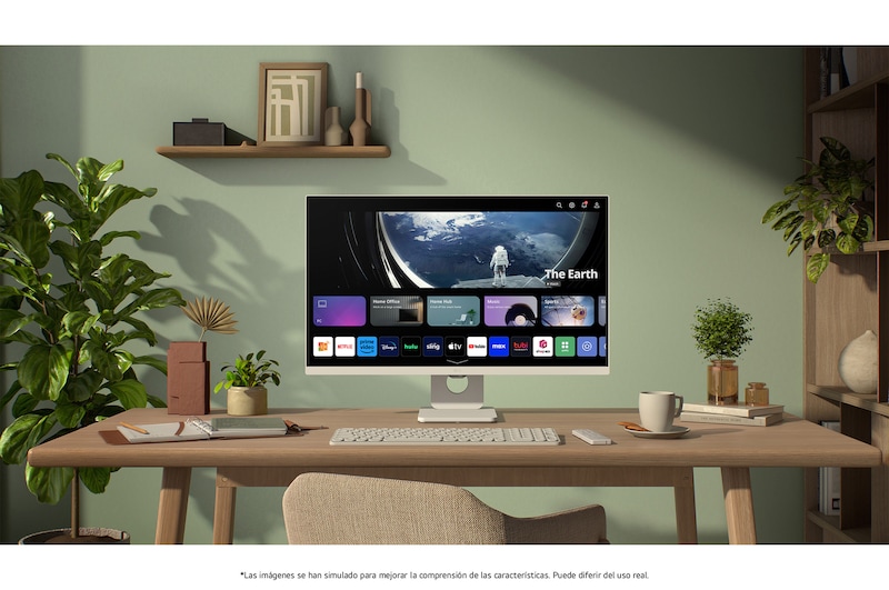 Monitor Inteligente LG 27U511SA en acabado blanco con webOS Smart Hub, mostrando aplicaciones de streaming para entretenimiento en un moderno entorno de oficina en casa con plantas
