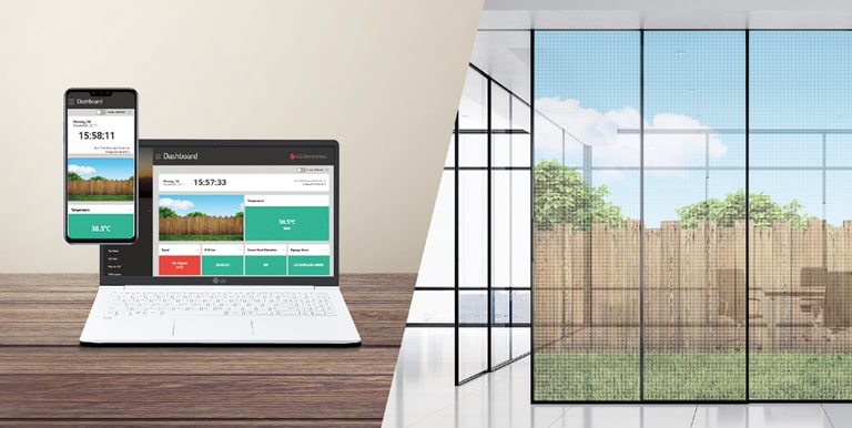 A través del Control Manager, gestiona la película transparente de la pared de la oficina con el teléfono móvil y la computadora portátil.