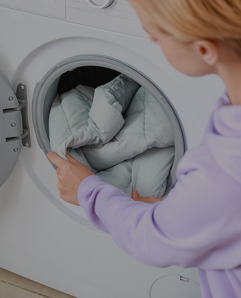 a child who takes the laundry out of the washing machine