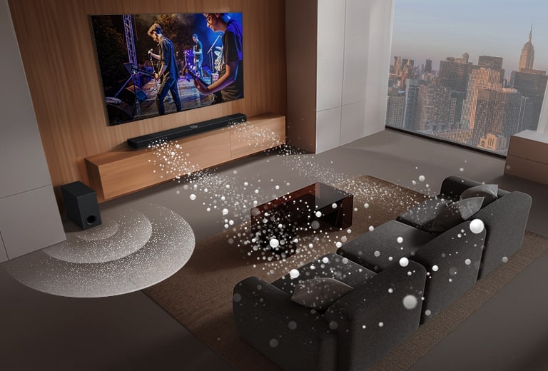 La barra de sonido LG, el televisor LG y el subwoofer se encuentran en una sala de estar mostrando una imagen en pantalla con una actuación musical. Dos ramas de ondas sonoras blancas formadas por gotas se proyectan desde la barra de sonido y un subwoofer crea un efecto de sonido desde abajo.