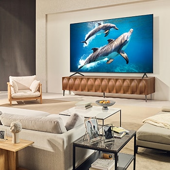 Sci-fi content is playing on an LG QNED TV screen. On the screen is the AI Chatbot interface. The user messaged the chatbot saying that the screen is too dark. The chatbot offered solutions to the request. The 