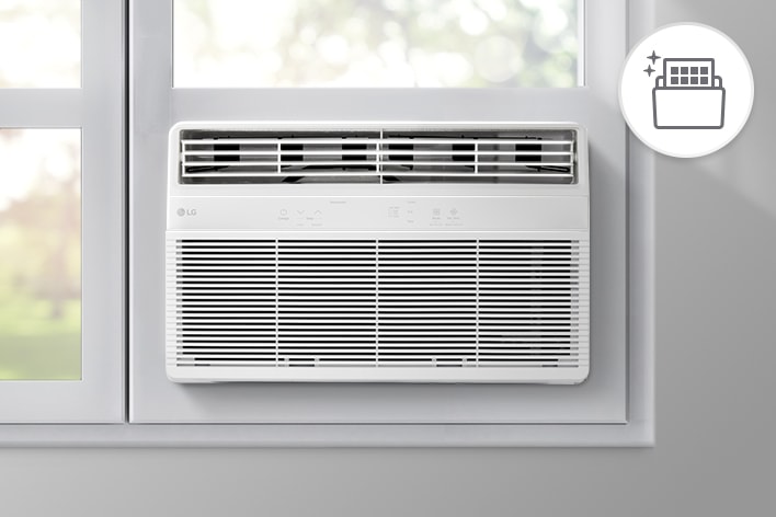 Aire acondicionado de ventana LG con filtro reutilizable y lavable en una habitación luminosa.