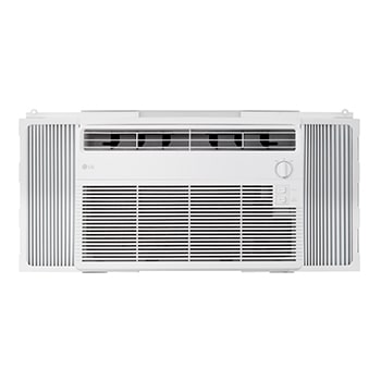 Window air conditioner installed in a living room with a sofa and plants