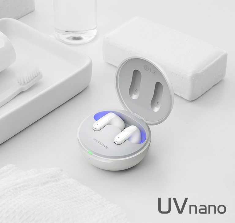 Image of TONE Free placed with objects representing cleanliness such as soap, toothbrush and toothpaste. The image contains a UVnano logo and Cnet logo.
