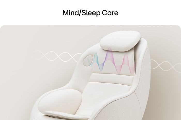 White massage chair with pastel brainwave waveform graphics above the headrest on a pale background.