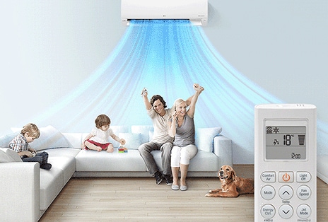A family is a room with the LG AC on. In the foreground is a remote control showing the buttons and temperature.