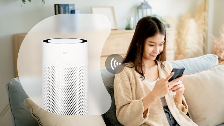 LG air purifier connected to a smartphone via Wi-Fi, highlighting convenient control and monitoring through the LG ThinQ app