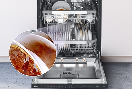 A Free-Standing dishwasher with the door fully open, revealing dirty dishes inside.