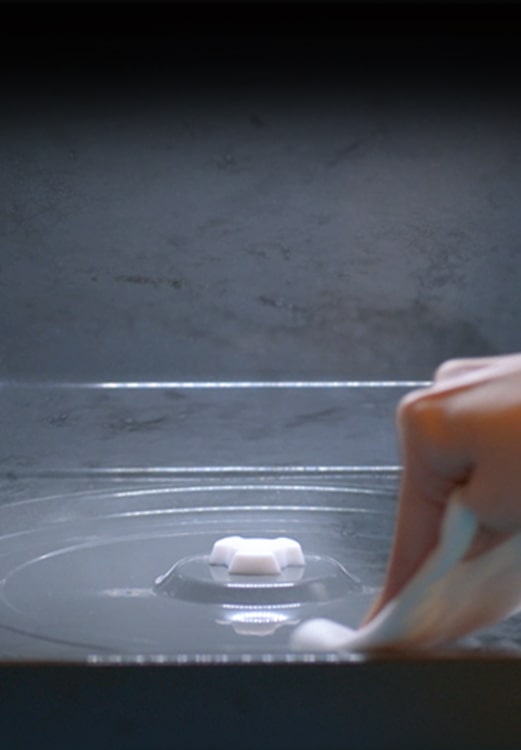 It shows a hand wiping the inner side of LG NeoChef™