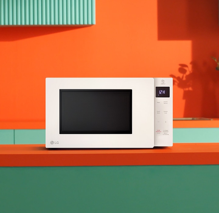 The image shows LG NeoChef Smart Inverter microwave oven colour black in the kitchen.