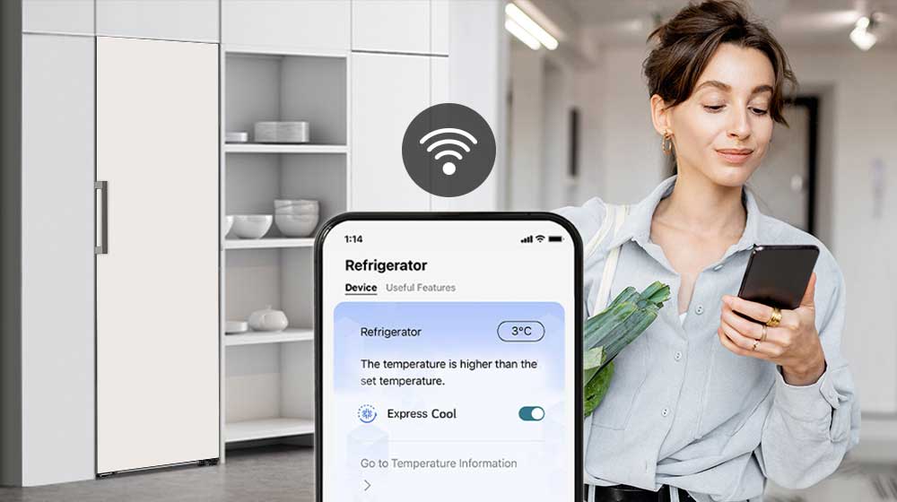The woman is looking at her cell phone.