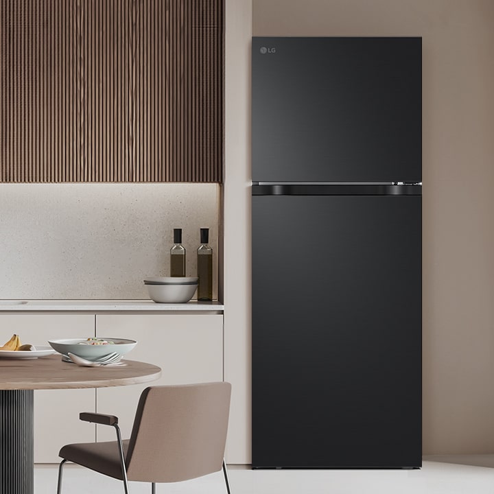 LG top freezer refrigerator is in modern kitchen, showcasing overall design of the refrigerator.
