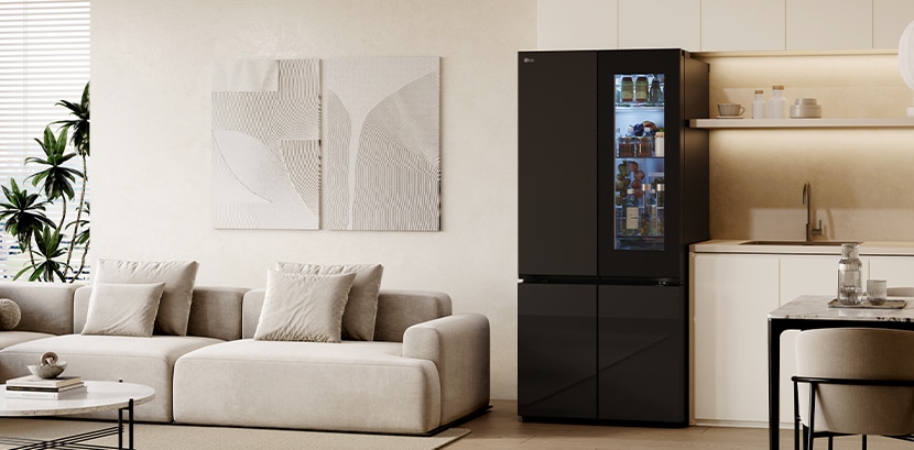 A cozy living room and kitchen are reflected in the sleek design of the lg french door refrigerator with mirror doors.