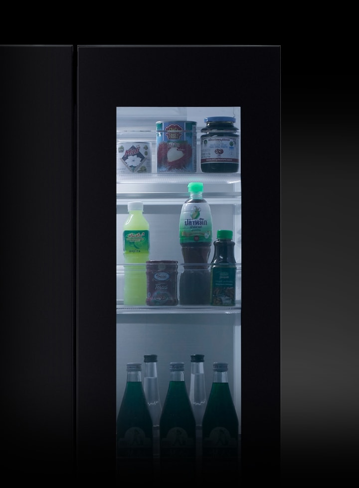 The lg refrigerator door is knocked on twice, and the InstaView light turns on, revealing the food items inside without opening the door.