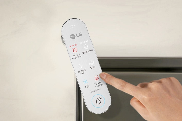 An image of a finger touching the control panel of the water purifier	