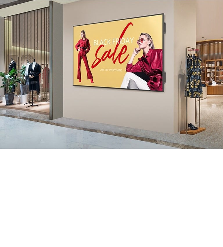 A large display is installed on a shopping mall’s interior wall, and the display’s screen is showing advertisements clearly and vibrantly.
