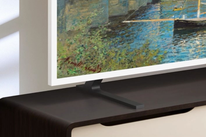 LG Gallery TV AI with frame LX7 ART TV and Height Adjustable Stand is placed on a media console as the stand moves up and down, allowing flexible screen positioning to fit different room layouts and viewing preferences.