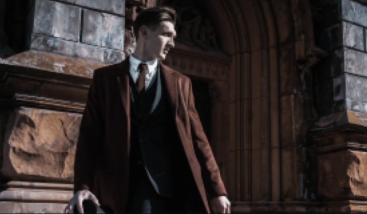 LG TV with AI Picture Pro shows a man in formal clothing beside arched stone architecture, as the alpha 11 AI Processor upscales the image to 4K, enhancing texture, depth, and contrast across the scene.