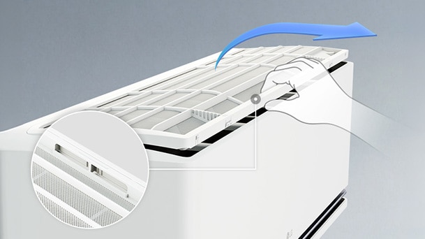 Hand removing the filter from an LG DUALCOOL AI Air for cleaning
